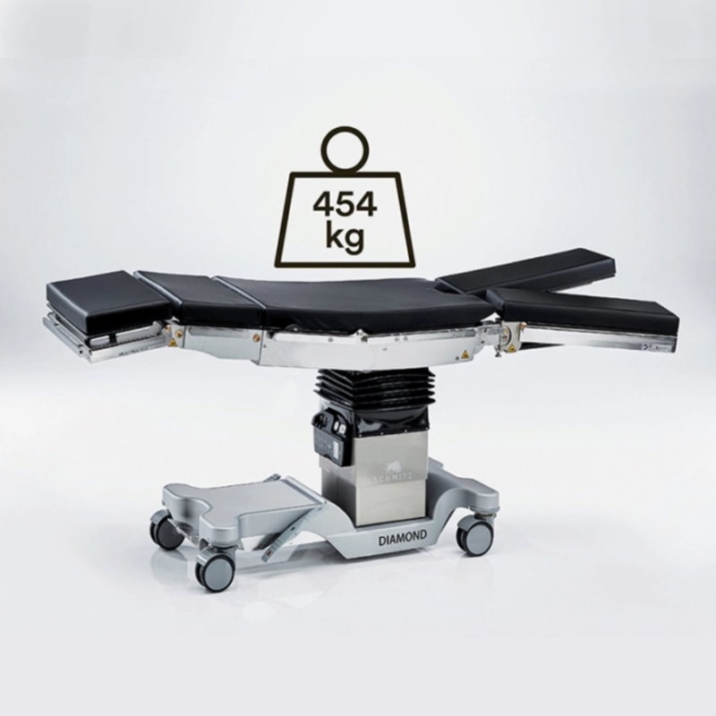 Medical operating table with weight indicator showing 454 kg on a white background