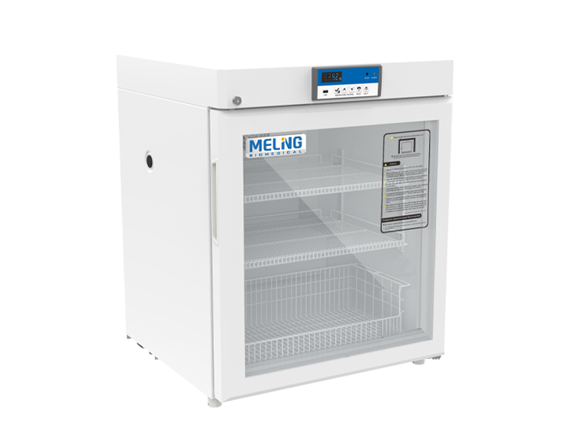 White laboratory refrigerator with glass door on a white background