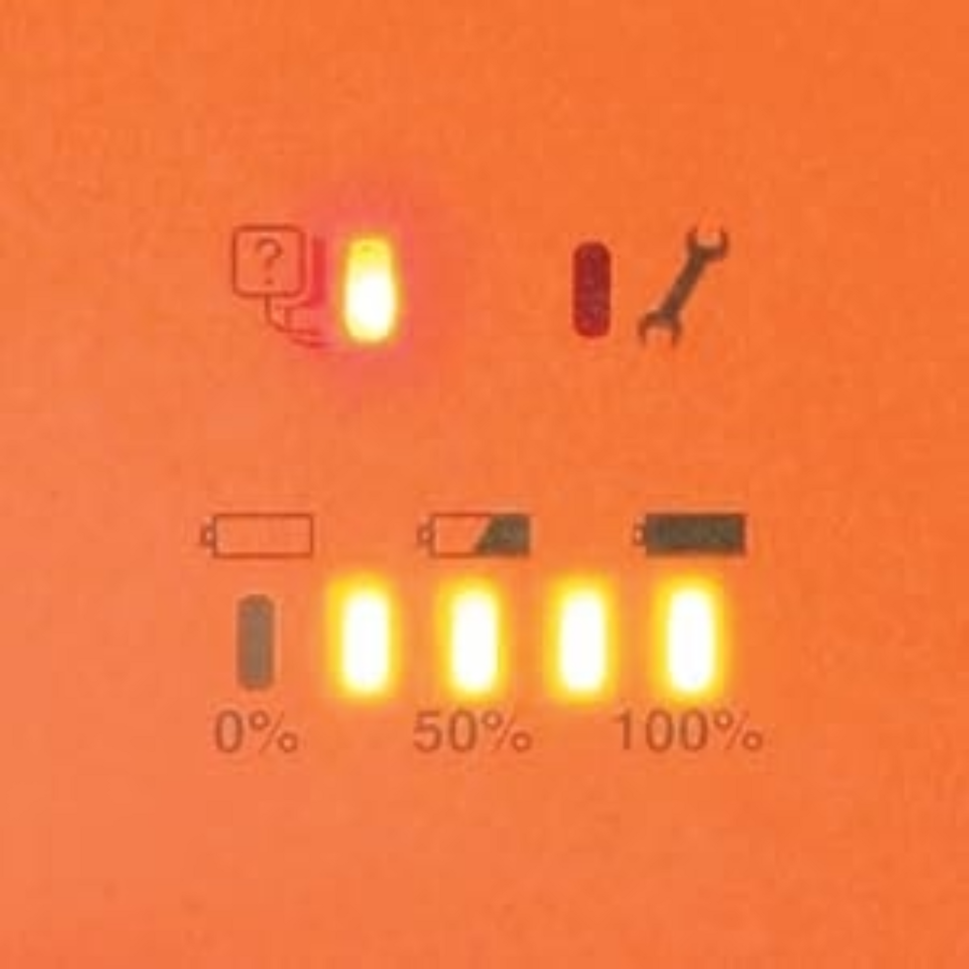 Digital display with icons and percentage indicators on an orange background