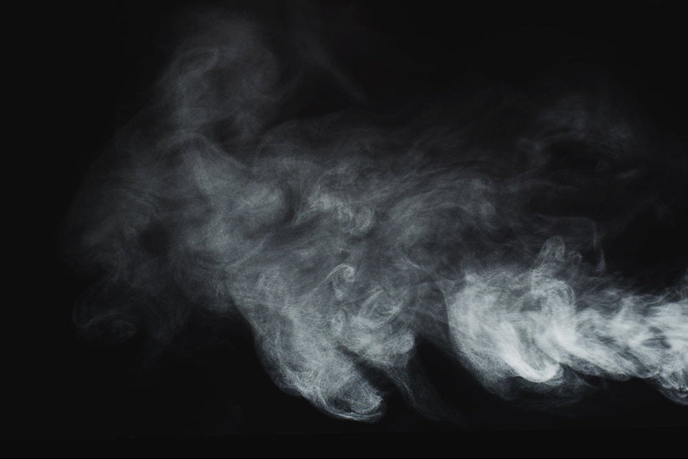 White smoke or fog effect on a black background